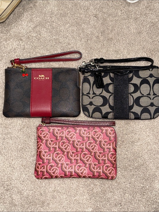 Coach Handbags - Pick one; COACH Wristlet in Brown w/ red stripe, Black w/ black stripe and Pink